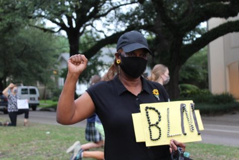 Ione, previous Loyola alumni, protests the injustices against the Black community.