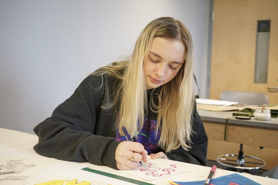 Fine arts junior Grace OMalley makes an art print. She opened her Etsy shop to make art more accessible. File photo. Photo credit: Cristian Orellana