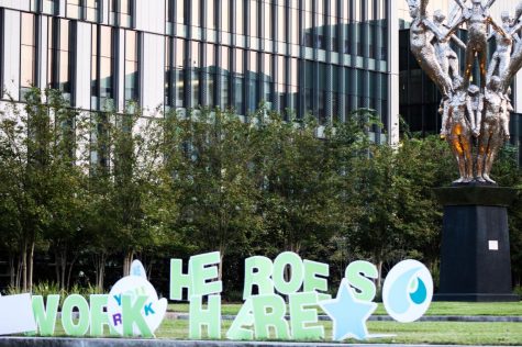 A “Heroes Work Here” sign sits in the front lawn of University Medical Center in New Orleans Oct. 4, 2020. During the COVID-19 pandemic, some healthcare industry workers have said that they’ve experienced stress and exhaustion due to long hours. Photo credit: Erin Haynes