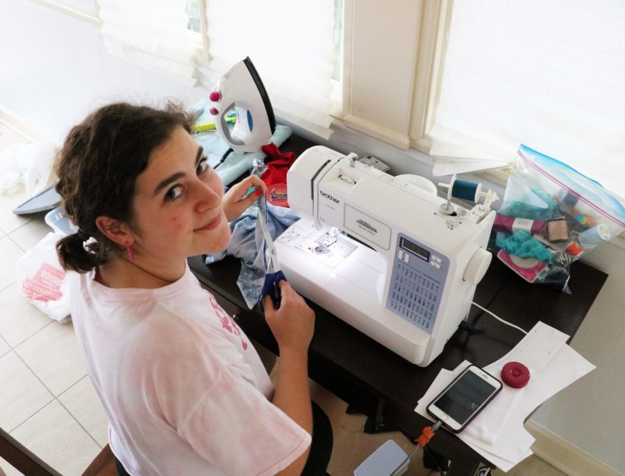 Graphic design senior Emilia Cicero practices sewing in her New Orleans home. Cicero is working toward opening an Instagram store to showcase her artwork. Hannah Renton/ The Maroon. Photo credit: Hannah Renton