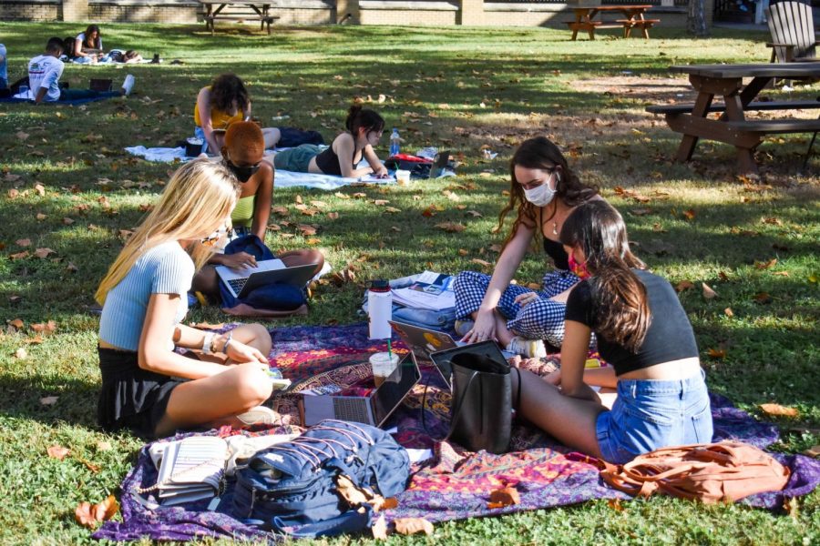 Students study in the residential quad on October 22, 2020. Safety guidelines this semester include requirements for students to wear masks in public spaces on campus. Photo credit: Maria Paula Marino
