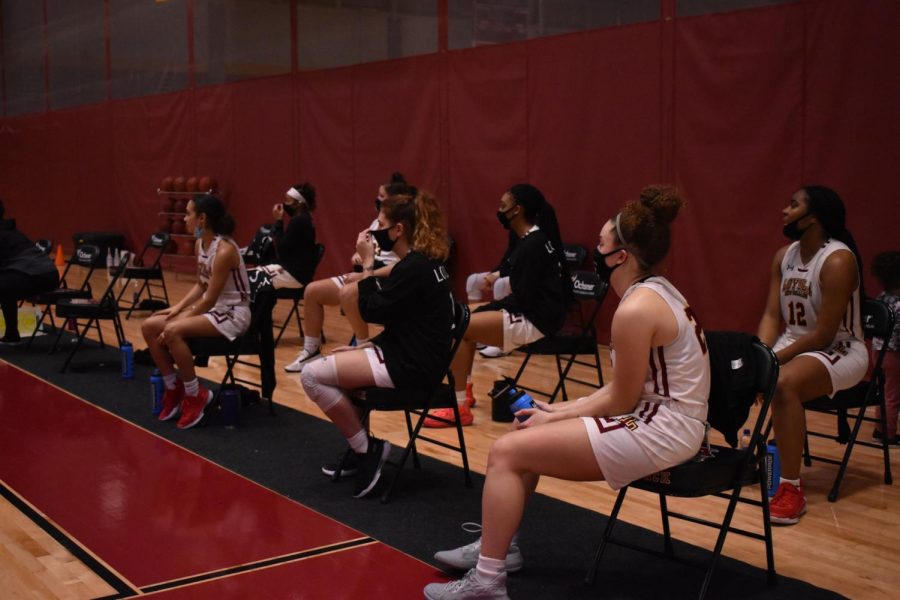Wolf+Pack+players+sit+on+the+bench+during+a+conference+win+against+Stillman+College.+Loyola+clinched+the+SSAC+West+Division+title+today+when+their+game+against+William+Carey+was+canceled.+Maria+Paula+Marino%2FThe+Maroon.+Photo+credit%3A+Maria+Paula+Marino