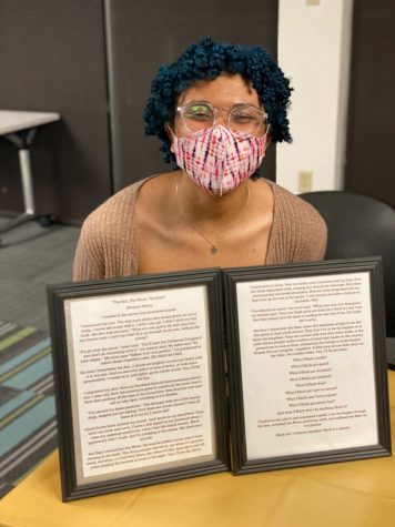 Breanna Henry poses with her piece, “The Sun, The Moon, The Stars” at the University Programming Board’s Black is Art event, Thursday, Feb. 18, 2021.