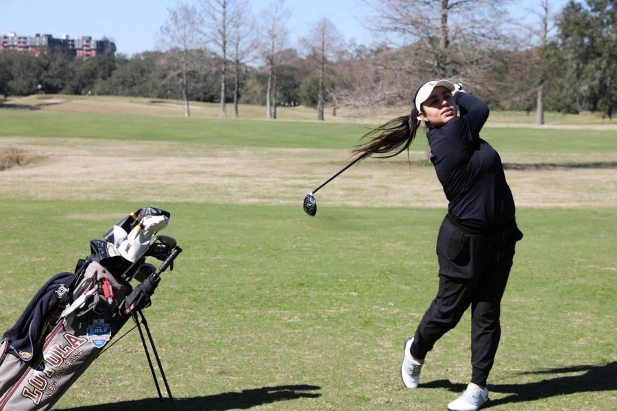 Alejandra+Bedoya+Tobar+is+on+the+backswing+of+her+golf+swing.