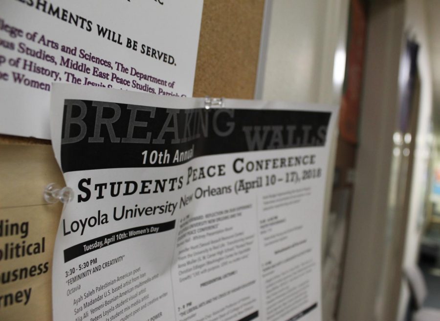 A peace conference flyer from 2018 hangs outside of the office of the director of Middle East peace studies. The peace conference takes place this year starting March 29. Photo credit: Gabriella Killett