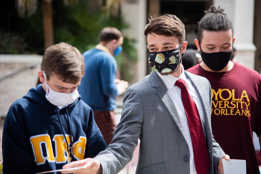 Christian Martinez, right, and Aidan Gibson, left, campaign for SGA president and vice president respectively during a Peace Quad campaign event. The pair was disqualified from the SGA race after being found guilty of multiple campaign violations.