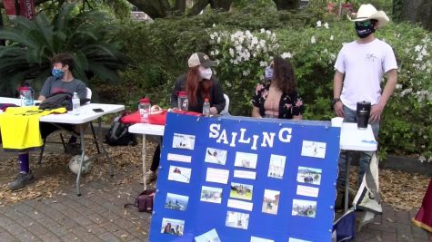 Members of the Loyola sailing club table in front of the Danna Center on March 30, 2021. Club sports teams use tabling to drum up student interest. Photo credit: Jabez Berniard