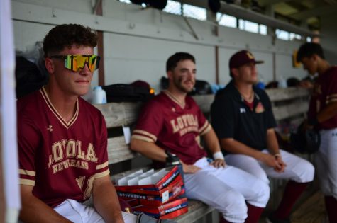 Loyola baseball players watch their teammates from the dugout during a 5-2 win against Brewton-Parker on April 9. Wolf Pack baseball made the NAIA top 25 poll for the first time since the program was reinstated in 1991. Photo credit: Gabrielle Korein