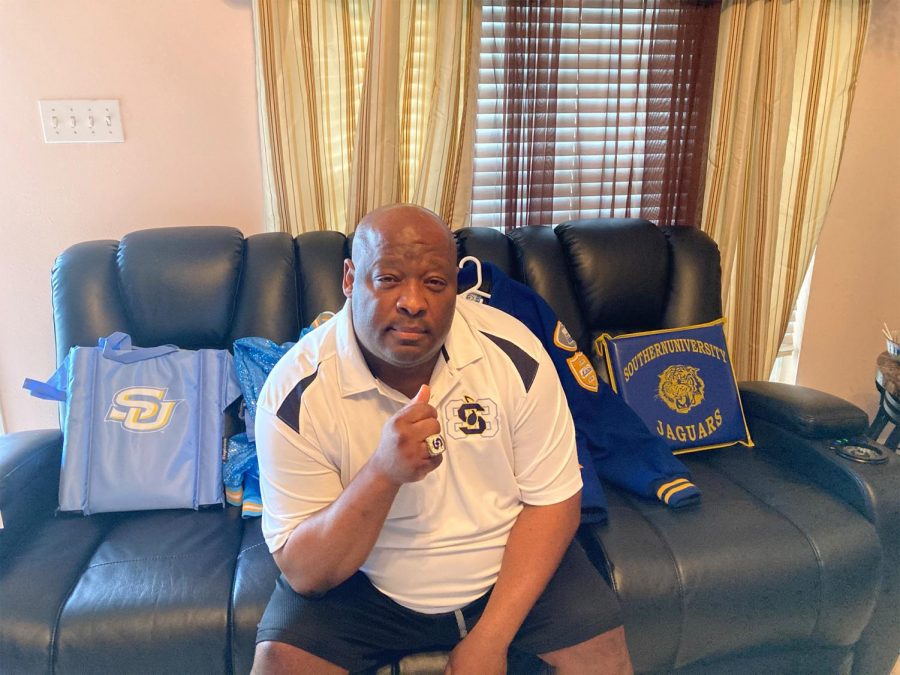 Marvin Williams, a former member of the Southern University marching band surrounds himself with memories of his time in the Human Jukebox. Williams is one alumnus who will not be attending this year's Bayou Classic because of the game moving to Shreveport. Photo credit: Deja Magee