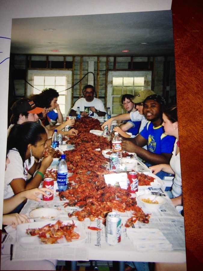 Loyola students gather at a crawfish boil after Hurricane Katrina in 2005 in History chair Mark Fernandezs gutted basement in New Orleans. Fernandez encouraged students to remain hopeful as they manage the aftermath of Hurricane Ida.