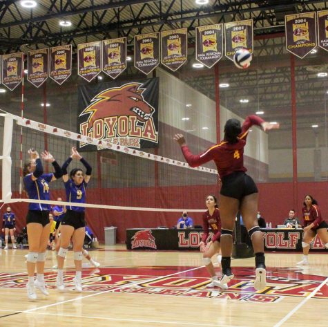 Sophomore recruit Simone Tyson preps for a spike at the Wolf Pack Invitational on Friday, August 27.