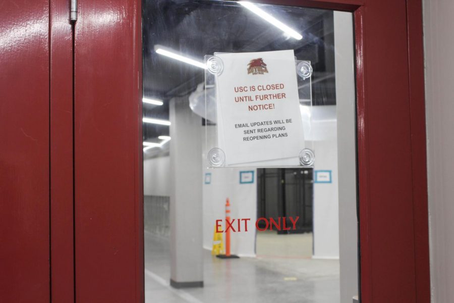 A closed sign is posted outside of the USC.
