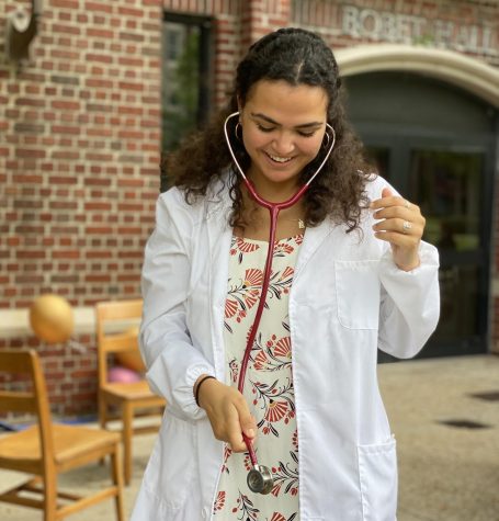 Grace Lalomia tries on her stethoscope outside of Bobet Hall on Saturday, Oct. 2, 2021.