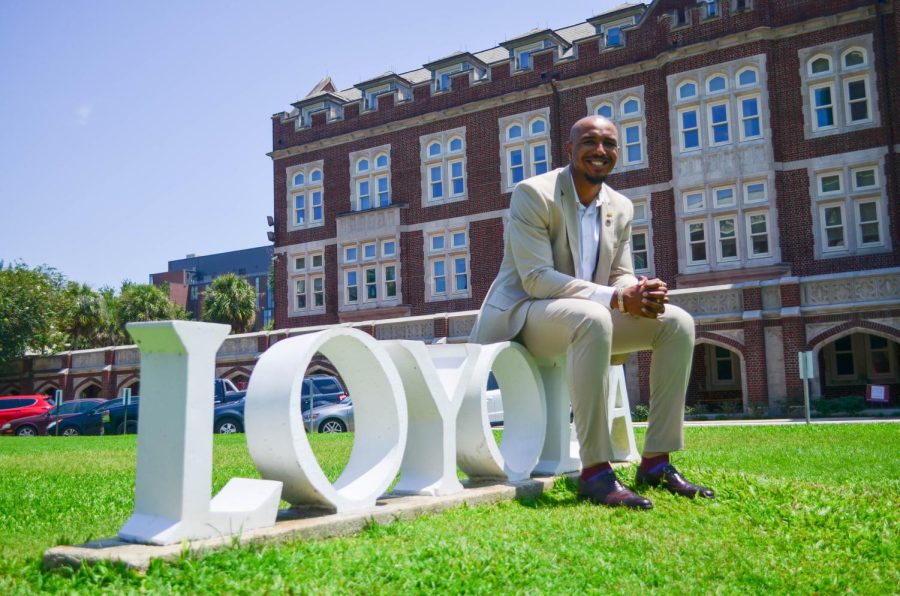Benjamin C. Fields sits at the front of Loyolas campus on the first week of school greeting incoming students on Tuesday, Aug. 24. Fields is Loyola Universitys newest and youngest board member.