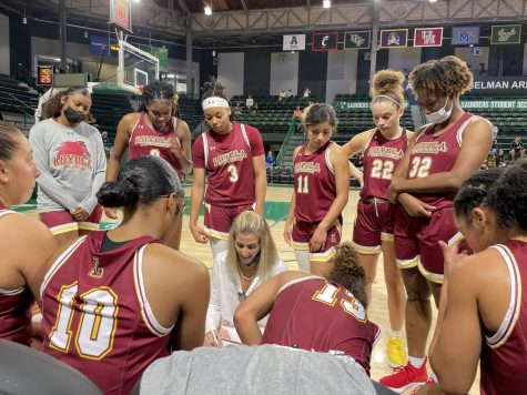 Loyolas womens basketball team reviews plays at their game against Tulane University at Devlin Fieldhouse, Nov. 2, 2021.