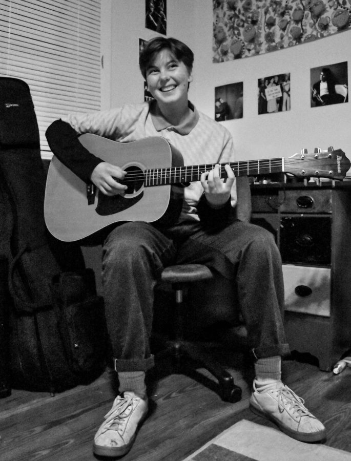 Teddy "Shmoo" Tietze poses with his guitar in his room last month. Tietze has more than ten thousand streams for his self-titled album he just released.