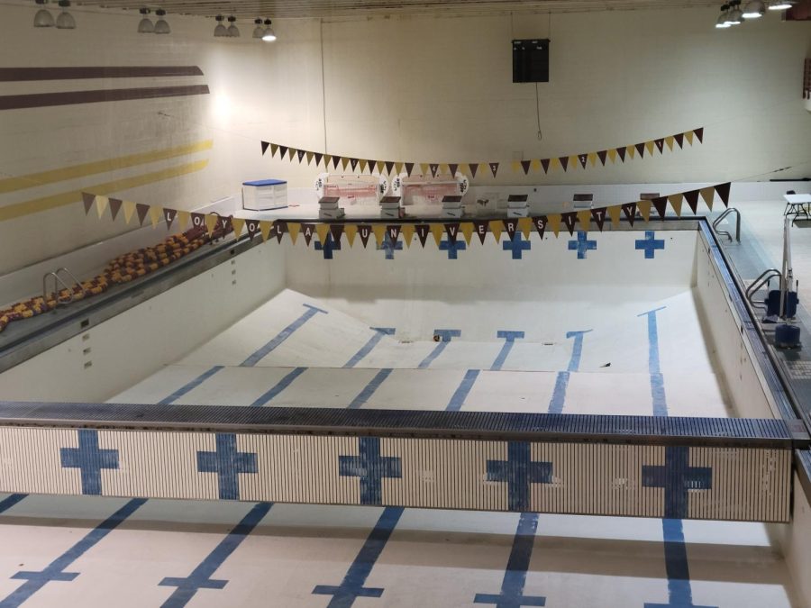The pool at the University Sports Complex continues to sit empty aside from a lone volleyball at its bottom on Jan. 20, 2022. Despite being unable to practice in their own pool, the swim team is performing well both in the water and behind the desk.
