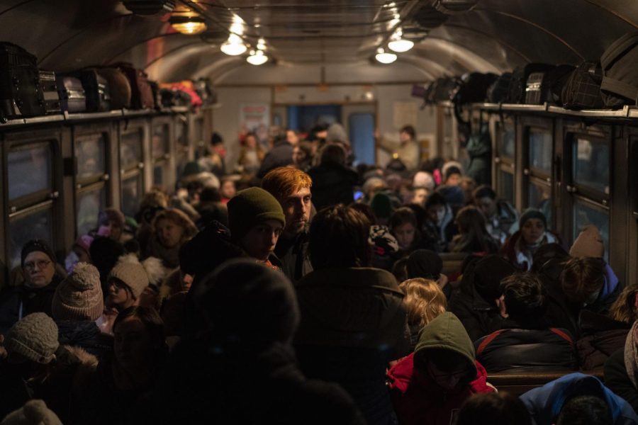 Displaced Ukrainians onboard a Poland bound train in Lviv, western Ukraine, Sunday, March 13, 2022. Lviv in western Ukraine itself so far has been spared the scale of destruction unfolding to its east and south. The citys population of 721,000 has swelled during the war with residents escaping bombarded population centers and as a waystation for the nearly 2.6 million people who have fled the country. (AP Photo/Bernat Armangue)