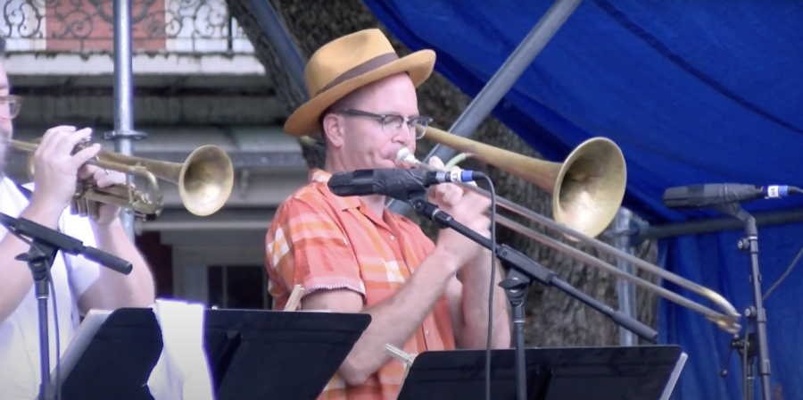 Man plays trumpet at French Quarter Festival