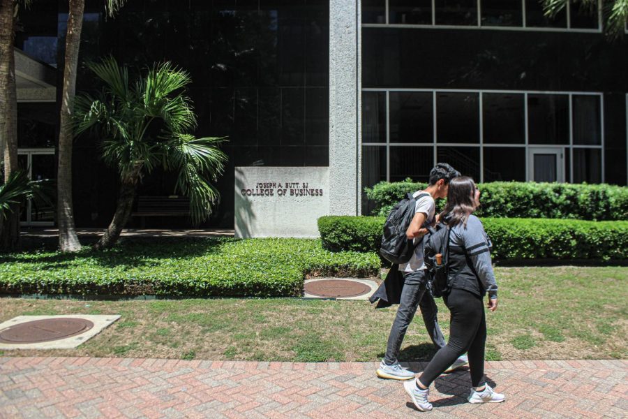 Students walk past the School of Business on April 27, 2022. The Center for Entrepreneurship and Community Development is hosting a business development bootcamp. 