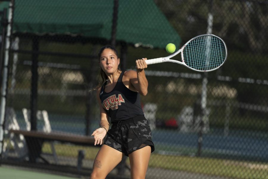 Senior Madelynn Chavez plays at the Xula Tennis Center this season. The womens tennis team hopes to win it all at the SSAC Championship April 21. Courtesy of Wolf Pack Athletics.