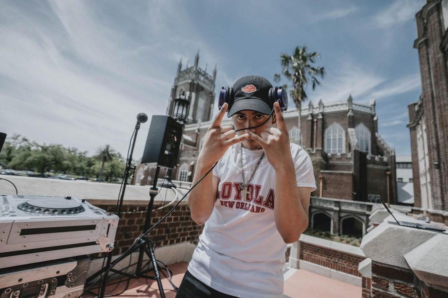 Jesus Tiscareno stands in front of Marquette Hall at Loyola while DJing at Senior Fest on April 19, 2022. Tiscareno is graduating from the Urban and Electronic Music Program this May. Courtesy of Angelo Joseph