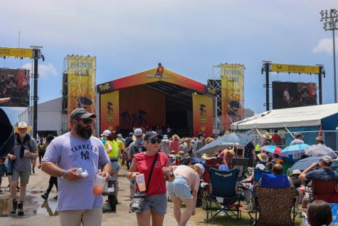 Festival goers wander past Jazz Fests Festival Stage May 1, 2022.
