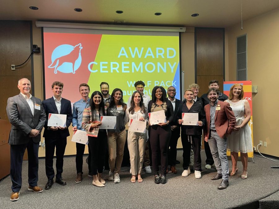 Finalists+in+the+LaunchU+entrepreneurship+competition+stand+and+pose+holding+certificates%2C+along+with+some+faculty+members.+This+photo+was+taken+at+the+final+pitch+competition.+There+is+a+projected+sign+behind+them+that+says+Award+Ceremony.