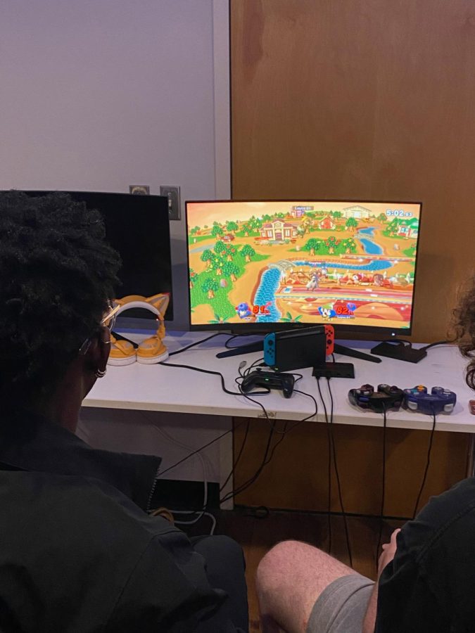 Computer showing Mario Super Smash Bros. tournament in Danna center basement art gallery