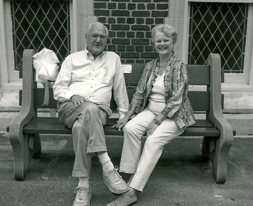Moon Landrieu and wife Verna Landrieu sit on bench