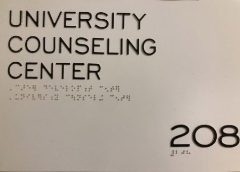 The sign for the University Counseling Center. It reads University Counseling Center and room 208.