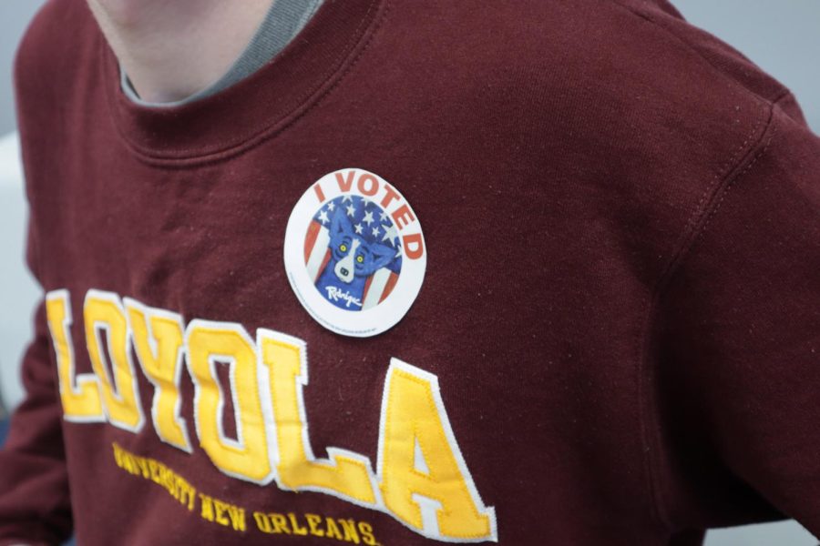 A Loyola student is pictured wearing George Rodrigues Blue Dog I Voted sticker.