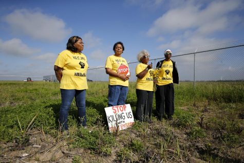 cancer alley residents with protesting signs