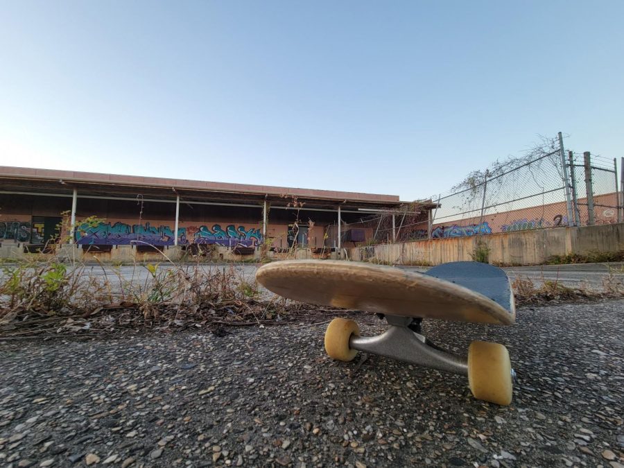 Skateboard in front of abandoned site