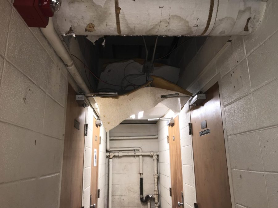 A ceiling in the Danna Center basement which has collapsed. Wires and pipes in the room are also visible.
