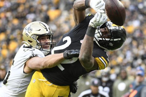 New Orleans Saints linebacker Kaden Elliss, left, breaks up a pass intended for Pittsburgh Steelers running back Najee Harris (22) during the second half of an NFL football game in Pittsburgh, Sunday, Nov. 13, 2022. 