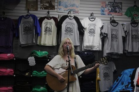A singer performing in a record store 