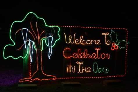light sign that says: Welcome to the celebration in the oaks