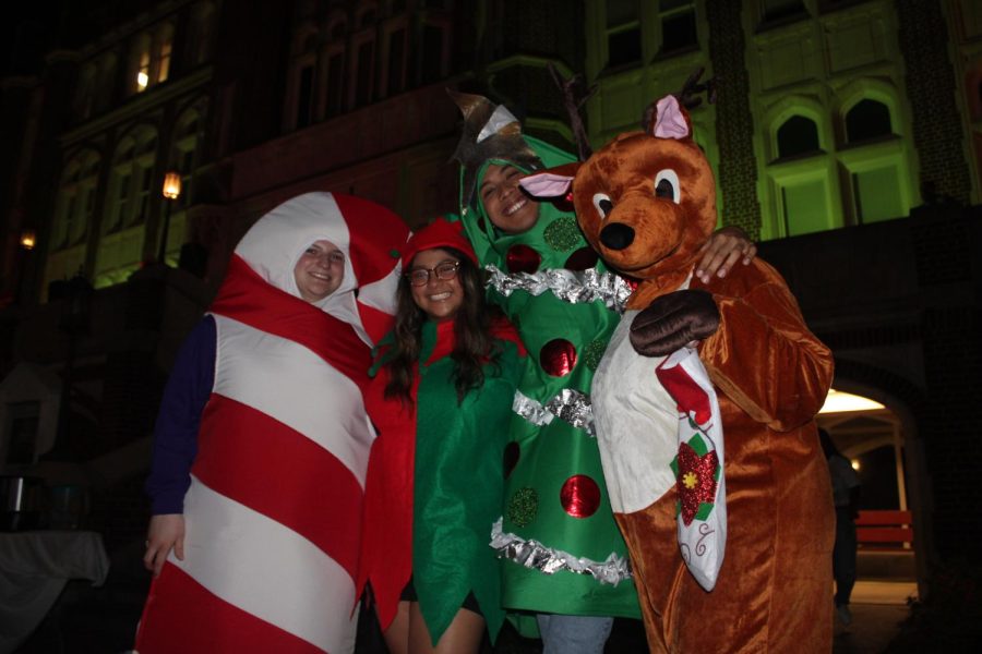 people in holiday costumes posing for a picture
