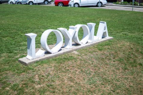 Sign in front of Loyola University New Orleans which reads Loyola.