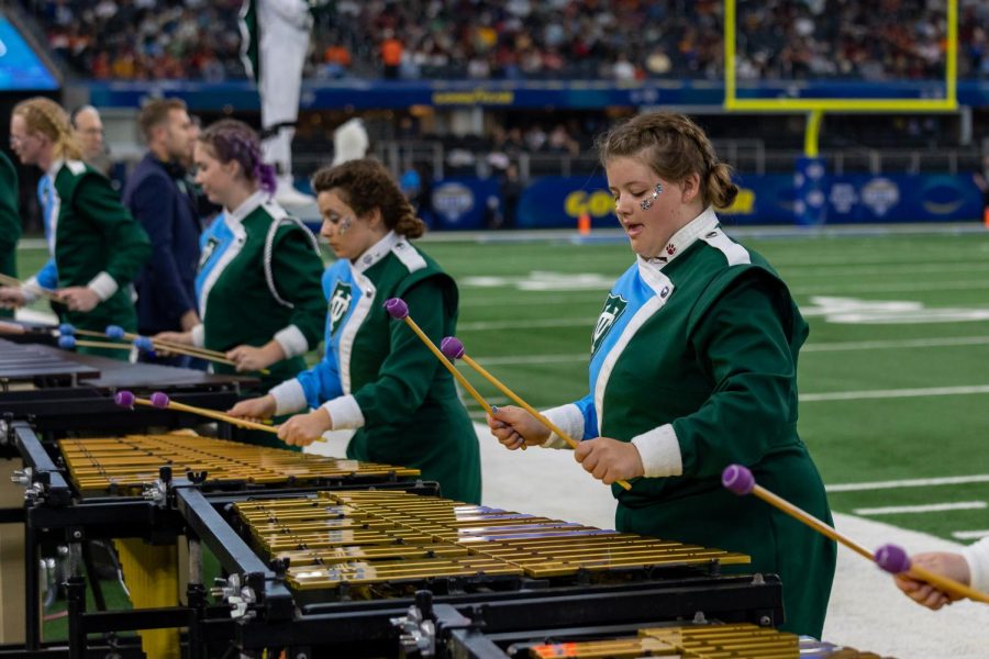 Loyola students perform with the Tulane University Marching Band