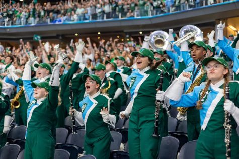 Loyola students perform with the Tulane University Marching Band.