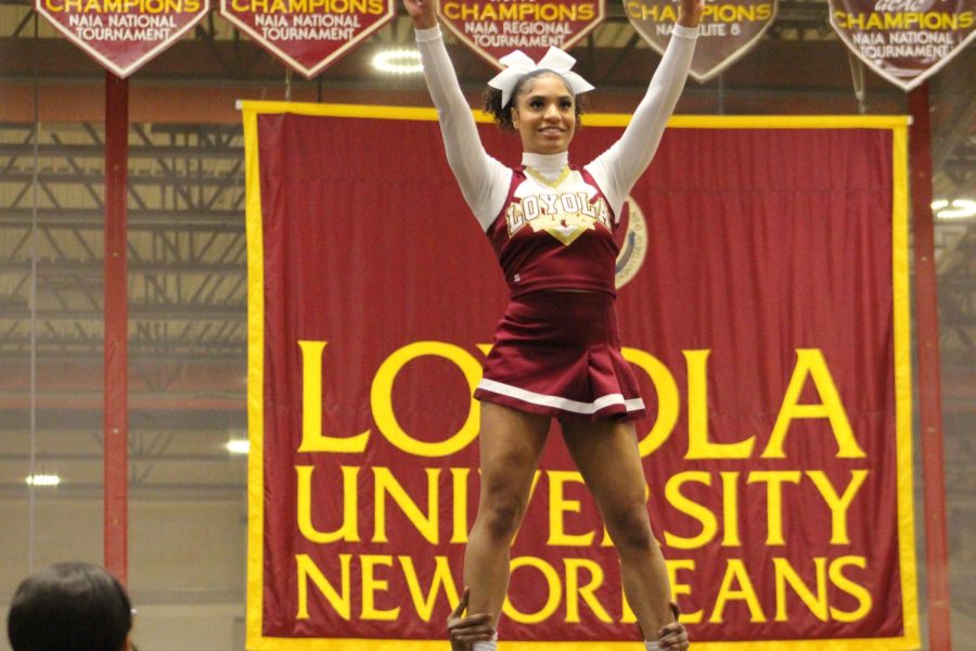 Senior biophysics major and co-captain Ana LeBlanc stands at the top of a pyramid during their routine at the University Sports Complex on Feb. 4, 2023.