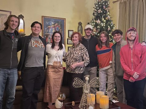 Students from the college and community course pose for the camera at the home of their professor.