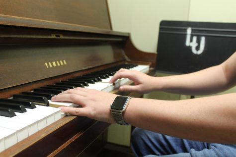 Jazz pianist practices in Loyola practice room.