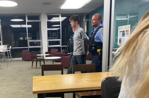 NOPD officers arresting student