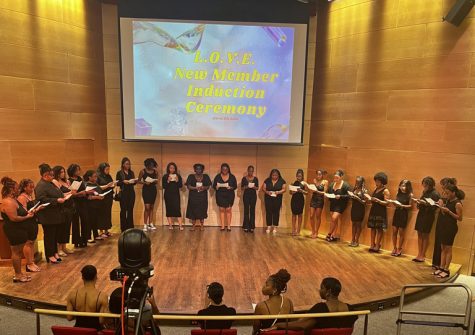 New members of L.OV.E. being inducted in Nunemaker auditorium on March 26. The organization inducted nearly 30 new members.