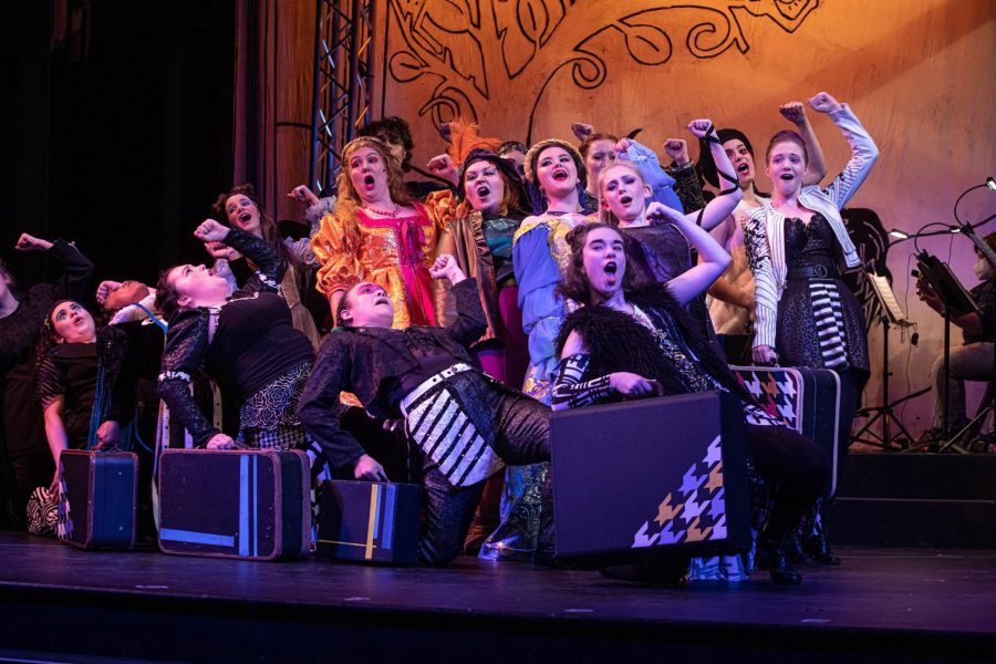 The cast of Head over Heels performs onstage in Loyolas Marquette Theater.