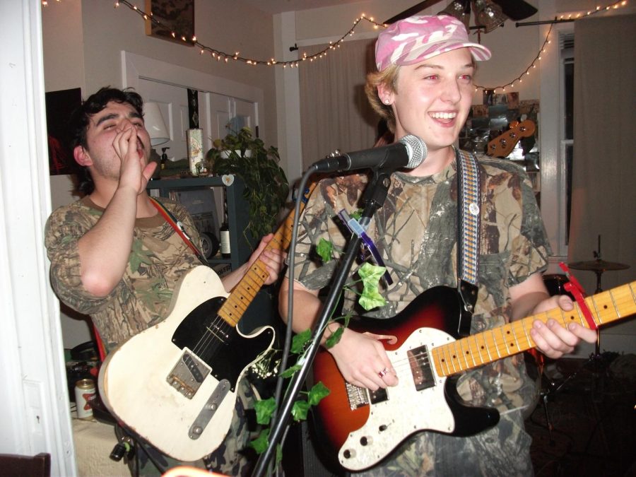 Gio Vantello (left)and Julian Weinheimer (right) play guitar at a house show