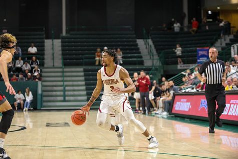 Myles Burns dribbles the ball against Benedictine University at Mesa at Devlin Fieldhouse on March 11, 2022.